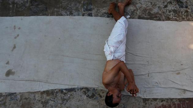 A devotee prays by rolling on the ground before taking a dip during the Swasthani Brata Katha festival. The festival begins on the full moon day of the Nepalese month of Poush, normally from January to February, ending on the next full moon day. (Navesh Chitrakar / REUTERS) A devotee prays by rolling on the ground before taking a dip during the Swasthani Brata Katha festival. The festival begins on the full moon day of the Nepalese month of Poush, normally from January to February, ending on the next full moon day. (Navesh Chitrakar / REUTERS)