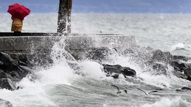 Big waves also lashed the lakeside promenade of Geneva, Switzerland. Thousands of households at Lake Zurich were left without power and firefighters were called to help with toppled trees blocking streets and flooding due to heavy rains. (Laurent Gillieron / Keystone via AP) Big waves also lashed the lakeside promenade of Geneva, Switzerland. Thousands of households at Lake Zurich were left without power and firefighters were called to help with toppled trees blocking streets and flooding due to heavy rains. (Laurent Gillieron / Keystone via AP)