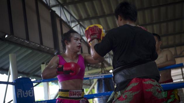 In life as in the ring, where she competes against men, finding her place has not always been easy. Transgender people in Thailand still can’t change their gender designation on identity papers, despite a 2015 law against gender-based discrimination. “When I started fighting (as a girl), I was afraid that people would not accept me,” she said. (Lilian Suwanrumpha / AFP) In life as in the ring, where she competes against men, finding her place has not always been easy. Transgender people in Thailand still can’t change their gender designation on identity papers, despite a 2015 law against gender-based discrimination. “When I started fighting (as a girl), I was afraid that people would not accept me,” she said. (Lilian Suwanrumpha / AFP)