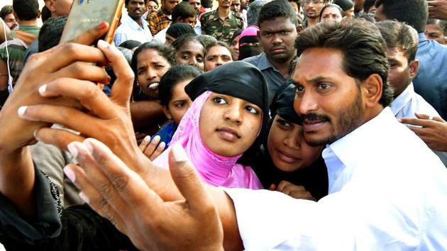 YSR Congress President YS Jaganmohan Reddy poses for a selfie with supporters during his 'Praja Sankalpa Yatra' at Kalikiri in Andhra Pradesh on Wednesday. (PTI) YSR Congress President YS Jaganmohan Reddy poses for a selfie with supporters during his 'Praja Sankalpa Yatra' at Kalikiri in Andhra Pradesh on Wednesday. (PTI)