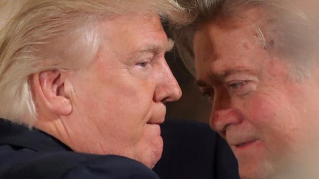 US President Donald Trump talks to Steve Bannon during a swearing in ceremony for senior staff at the White House in Washington on January 22, 2017. (Reuters) US President Donald Trump talks to Steve Bannon during a swearing in ceremony for senior staff at the White House in Washington on January 22, 2017. (Reuters)