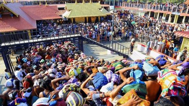 File photo of devotees gathered at the Sabarimala Lord Ayyappa Temple in Pathanamthitta, Kerala. (PTI) File photo of devotees gathered at the Sabarimala Lord Ayyappa Temple in Pathanamthitta, Kerala. (PTI)