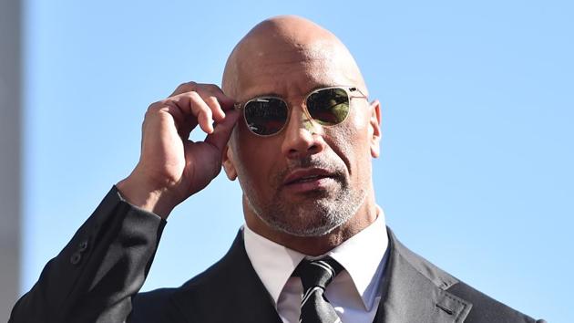 Actor Dwayne Johnson attends a ceremony honouring him with the 2,624th star on the Hollywood Walk of Fame on December 13, 2017 in Hollywood. (AFP)