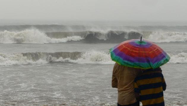 People watch rough sea waves at Juhu beach during rain showers brought by the remnants of cyclone Ockhi in Mumbai on December 5, 2017 .(AFP File Photo)