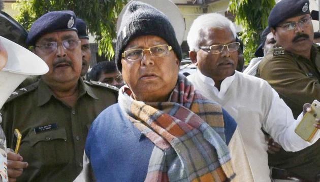 Bihar's former chief minister Lalu Yadav escorted by police officials after appearing at the special CBI court, in Ranchi on Wednesday. (PTI) Bihar's former chief minister Lalu Yadav escorted by police officials after appearing at the special CBI court, in Ranchi on Wednesday. (PTI)