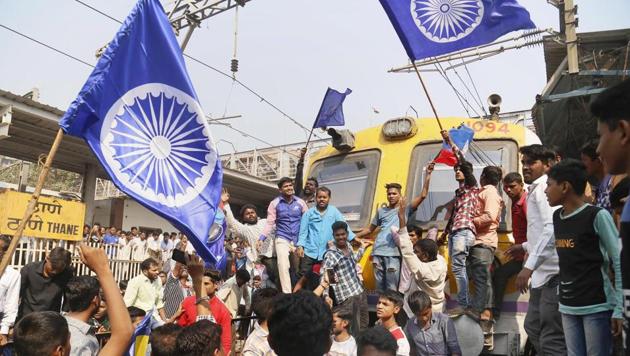 Dalit groups protesting at Thane railway station during the Maharashtra Bandh on Wednesday following clashes between two groups in Bhima Koregaon near Pune(PTI) Dalit groups protesting at Thane railway station during the Maharashtra Bandh on Wednesday following clashes between two groups in Bhima Koregaon near Pune(PTI)