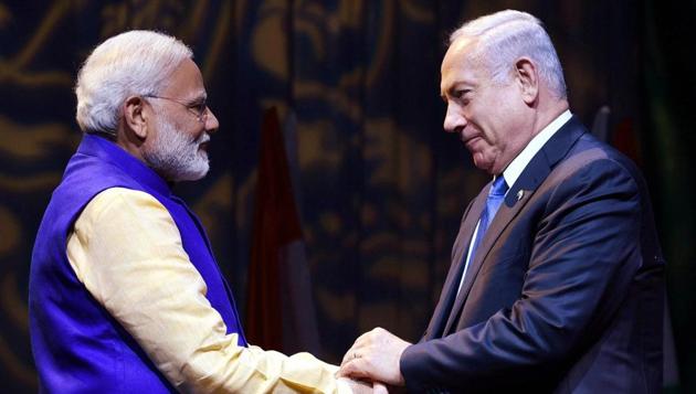 Prime Minister Narendra Modi shakes hands with Israeli Prime Minister Benjamin Netanyahu at the Community Reception Programme, in Tel Aviv, Israel. (PTI FILE) Prime Minister Narendra Modi shakes hands with Israeli Prime Minister Benjamin Netanyahu at the Community Reception Programme, in Tel Aviv, Israel. (PTI FILE)