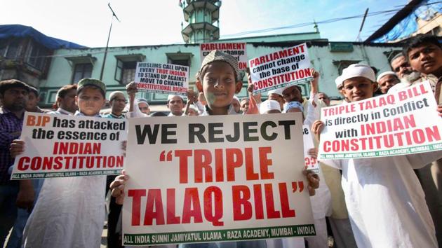 Muslims pose with placards to protest against the government over the triple talaq bill in Mumbai. (PTI) Muslims pose with placards to protest against the government over the triple talaq bill in Mumbai. (PTI)