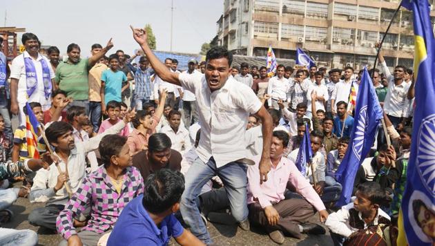 Dalit protesters block a road during the Maharashtra bandh over the Bhima Koregaon violence, in Thane, Mumbai, on Wednesday.(PTI Photo) Dalit protesters block a road during the Maharashtra bandh over the Bhima Koregaon violence, in Thane, Mumbai, on Wednesday.(PTI Photo)