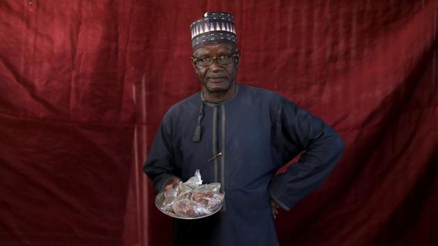 Jibril Adamu holds okra seeds and sugared groundnuts, ready for exchange at a camp in Nigeria. Reports of corruption in the humanitarian crisis relief efforts are rife. Those involved, such as government officials, aid workers and soldiers, are alleged to skim from the top before distributing aid. (Afolabi Sotunde / REUTERS) Jibril Adamu holds okra seeds and sugared groundnuts, ready for exchange at a camp in Nigeria. Reports of corruption in the humanitarian crisis relief efforts are rife. Those involved, such as government officials, aid workers and soldiers, are alleged to skim from the top before distributing aid. (Afolabi Sotunde / REUTERS)