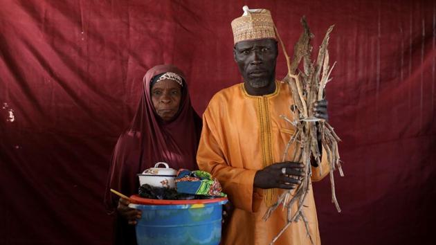 Aisha Umaru (L) holds a basin of milk as Umari Usman Kaski holds up firewood in Nigeria. Many of those responding to the crisis are also concerned that with economic prospects dim for the foreseeable future, millions of people will become dependent on the aid, the vast majority of which comes from abroad. (Afolabi Sotunde / REUTERS) Aisha Umaru (L) holds a basin of milk as Umari Usman Kaski holds up firewood in Nigeria. Many of those responding to the crisis are also concerned that with economic prospects dim for the foreseeable future, millions of people will become dependent on the aid, the vast majority of which comes from abroad. (Afolabi Sotunde / REUTERS)