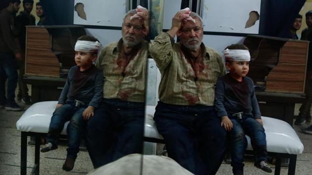 A Syrian man and a child, who were injured in shelling on the town of Misraba, receive treatment at a makeshift hospital in the besieged rebel-held town of Douma, on the outskirts of the capital Damascus early Thursday. (AFP) A Syrian man and a child, who were injured in shelling on the town of Misraba, receive treatment at a makeshift hospital in the besieged rebel-held town of Douma, on the outskirts of the capital Damascus early Thursday. (AFP)