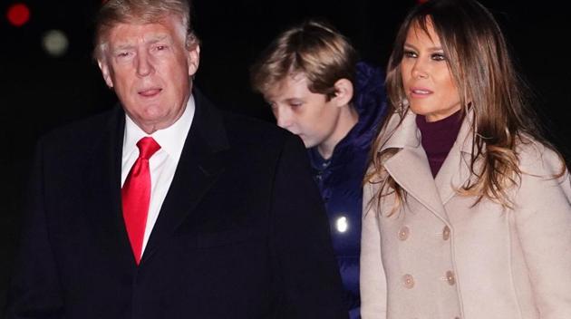US president Donald Trump, First Lady Melania Trump and son Barron at the White House in Washington, DC on January 1, 2018.(AFP Photo) US president Donald Trump, First Lady Melania Trump and son Barron at the White House in Washington, DC on January 1, 2018.(AFP Photo)