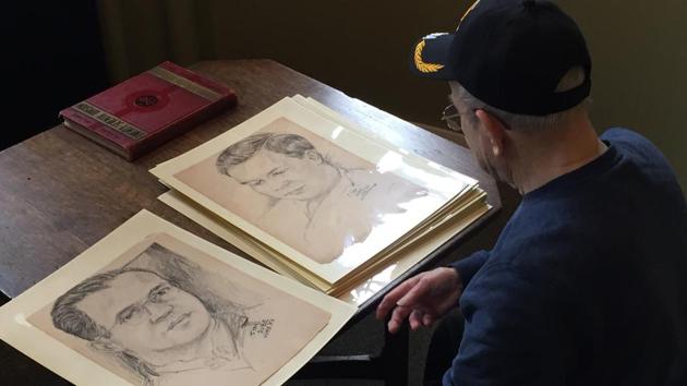 World War II veteran Wilfred “Spike” Mailloux looks through a series of sketches of US Army 27th Infantry Division soldiers while visiting the New York State Military Museum and Veterans Research Center in Saratoga Springs, NY. (AP Photo) World War II veteran Wilfred “Spike” Mailloux looks through a series of sketches of US Army 27th Infantry Division soldiers while visiting the New York State Military Museum and Veterans Research Center in Saratoga Springs, NY. (AP Photo)