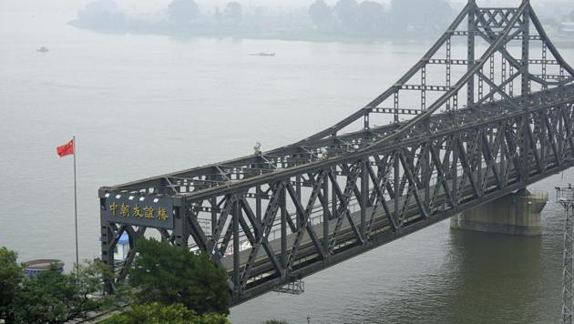 A Chinese flag flies over the Chinese end of the Friendship Bridge connecting China and North Korea in Dandong in northeastern China's Liaoning province. (AP File Photo) A Chinese flag flies over the Chinese end of the Friendship Bridge connecting China and North Korea in Dandong in northeastern China's Liaoning province. (AP File Photo)
