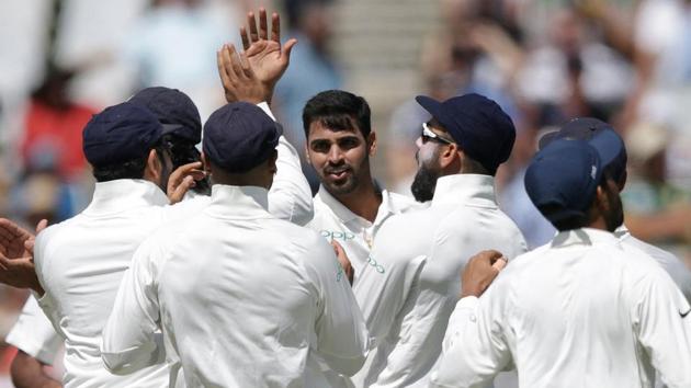 India fast bowler Bhuvneshwar Kumar (C) celebrates the dismissal of South African batsman Dean Elgar. (AFP)