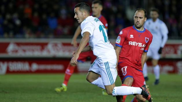 Real Madrid's Lucas Vazquez (L) is tackled by Numancia defender Unai Medina during the Copa del Rey Round of 16 first leg football match at Nuevo Estadio Los Pajaritos Stadium in Soria. (AFP) Real Madrid's Lucas Vazquez (L) is tackled by Numancia defender Unai Medina during the Copa del Rey Round of 16 first leg football match at Nuevo Estadio Los Pajaritos Stadium in Soria. (AFP)