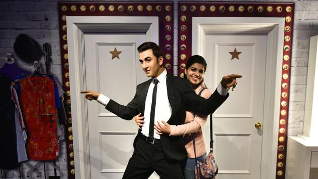 A girl poses for a photo with a wax figure of Bollywood actor Ranbir Kapoor. Madame Tussauds has been a successful tourist attraction in places like London, Las Vegas, New York, Orlando, San Francisco and Hong Kong. Its maiden facility in India has wax statues of Indian personalities like Prime Minister Narendra Modi, cinema icon Amitabh Bachchan and Father of the Nation Mahatma Gandhi, along with many Hollywood celebrities. (Sanchit Khanna / HT Photo)