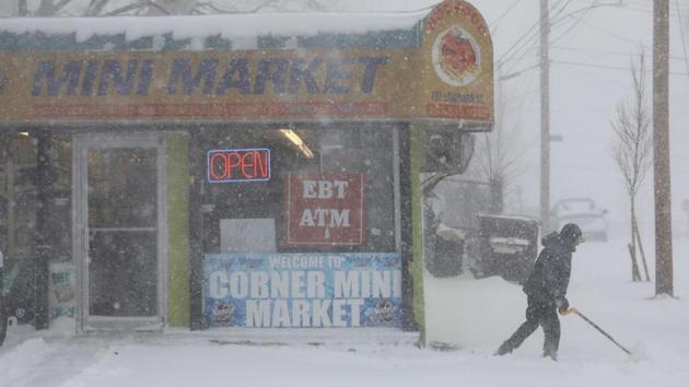 A shopkeeper shovels snow in New Haven, Connecticut. The only nuclear plant in Massachusetts was shut just after 2 pm because of the failure of a line that connects the reactor to the power grid. ISO New England, which operates the region’s power grid, attributed the shutdown to blizzard conditions. The company did not say when the station would restart. (John Moore / Getty Images / AFP)