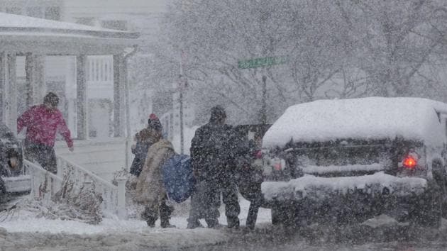 Residents evacuate in a Humvee as flood waters rise in Scituate, Massachusetts. A 3-foot tidal surge flooded the area around Boston’s historic Long Wharf with icy seawater. The flooding tied a 40-year record, the National Weather Service said. (Scott Eisen / Getty Images / AFP)