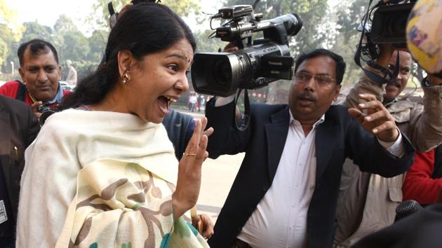 After acquitted from 2G spectrum allocation scam case, DMK leader Kanimozhi gestures when greeted by Congress leader Renuka Chowdhury (not pictured) as they attend the winter session in December. (Arvind Yadav / HT Photo) After acquitted from 2G spectrum allocation scam case, DMK leader Kanimozhi gestures when greeted by Congress leader Renuka Chowdhury (not pictured) as they attend the winter session in December. (Arvind Yadav / HT Photo)