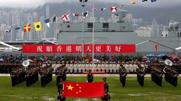 People's Liberation Army Navy soldiers take part in a parade with a banner "Wishing Hong Kong a Better Tomorrow", during an open day at a naval base in Hong Kong, China. (Reuters File Photo) People's Liberation Army Navy soldiers take part in a parade with a banner "Wishing Hong Kong a Better Tomorrow", during an open day at a naval base in Hong Kong, China. (Reuters File Photo)