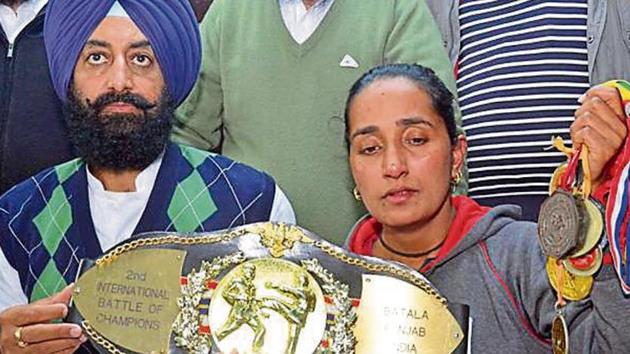 Balbir Kaur (right), sister of victim Kuldeep Kaur, and SAD leader Ravi Karan Kahlon showing medals bagged by the karate player at a press conference in Amritsar on Friday. (Sameer Sehgal/HT) Balbir Kaur (right), sister of victim Kuldeep Kaur, and SAD leader Ravi Karan Kahlon showing medals bagged by the karate player at a press conference in Amritsar on Friday. (Sameer Sehgal/HT)