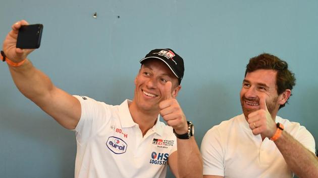 Former head coach of Premier League football teams Chelsea and Tottenham Hotspur, Andre Villas-Boas (R) and Dutch driver Bernhard Ten Brinke take a selfie during the pre-event press conference of the Dakar Rally in Lima on Friday.(AFP)