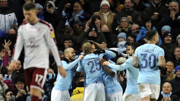 Manchester City players celebrate after Leroy Sane scored his side's third goal during the English FA Cup 3rd round match against Burnley. (AP) Manchester City players celebrate after Leroy Sane scored his side's third goal during the English FA Cup 3rd round match against Burnley. (AP)