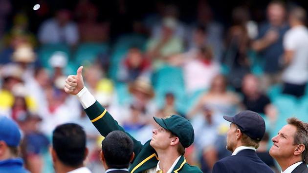 England's Joe Root watches as Australia's captain Steve Smith tosses the coin before the start of the first day of the fifth Ashes cricket test match on January 04, 2018 in Sydney, Australia. (David Gray / REUTERS) England's Joe Root watches as Australia's captain Steve Smith tosses the coin before the start of the first day of the fifth Ashes cricket test match on January 04, 2018 in Sydney, Australia. (David Gray / REUTERS)