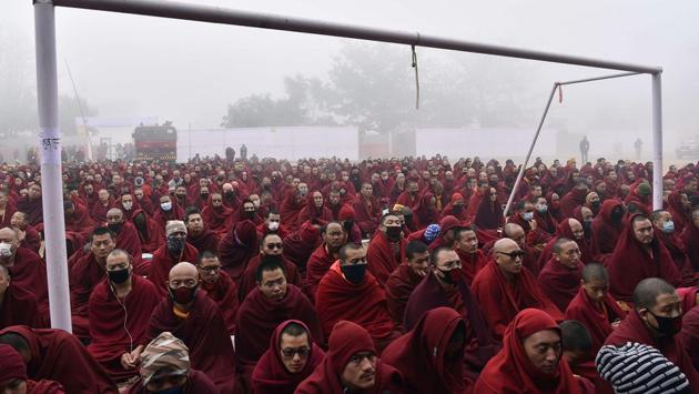 Buddhist monks sit on a football field next to goal posts as they listen to the teachings of the Tibetan spiritual leader the Dalai Lama in Bodhgaya in Bihar. (AFP) Buddhist monks sit on a football field next to goal posts as they listen to the teachings of the Tibetan spiritual leader the Dalai Lama in Bodhgaya in Bihar. (AFP)