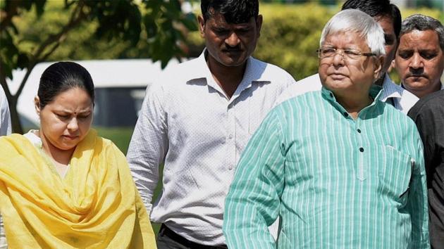 RJD leader and former railway minister Lalu Prasad, accompanied by his daughter Misa, arrives at the CBI headquarters in New Delhi. (PTI File Photo) RJD leader and former railway minister Lalu Prasad, accompanied by his daughter Misa, arrives at the CBI headquarters in New Delhi. (PTI File Photo)