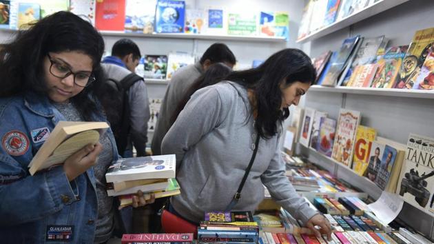 People look through books at New Delhi World Book Fair held near Pragati Maidan in New Delhi on Saturday. (PTI) People look through books at New Delhi World Book Fair held near Pragati Maidan in New Delhi on Saturday. (PTI)