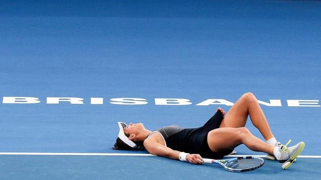 Garbine Muguruza reacts before retiring from her second round match against Aleksandra Krunic of Serbia at the Brisbane International tennis tournament on January 2, 2018 in Australia. World number two Muguruza suffered a fitness scare ahead of this month's Australian Open when she was forced to retire with severe cramping. (Franca Tigani / AFP) Garbine Muguruza reacts before retiring from her second round match against Aleksandra Krunic of Serbia at the Brisbane International tennis tournament on January 2, 2018 in Australia. World number two Muguruza suffered a fitness scare ahead of this month's Australian Open when she was forced to retire with severe cramping. (Franca Tigani / AFP)