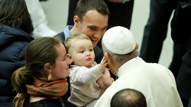 A baby caresses Pope Francis during his Wednesday general audience in Paul VI hall on January 03, 2018 at the Vatican. (Remo Casilli / REUTERS) A baby caresses Pope Francis during his Wednesday general audience in Paul VI hall on January 03, 2018 at the Vatican. (Remo Casilli / REUTERS)