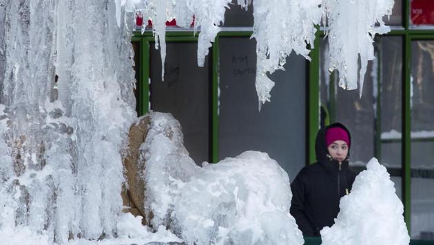 A woman passes an ice-covered fountain in New York's Bryant Park, Friday, Jan. 5, 2018. (AP) A woman passes an ice-covered fountain in New York's Bryant Park, Friday, Jan. 5, 2018. (AP)