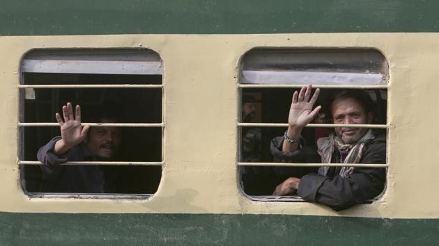 Indian fishermen wave to journalists from a train as they leave for their homeland in Karachi on Sunday. (AP Photo) Indian fishermen wave to journalists from a train as they leave for their homeland in Karachi on Sunday. (AP Photo)