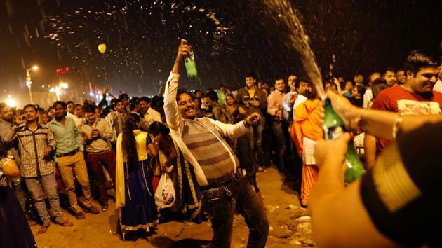 People dance during the New Year's celebrations on a beach in Mumbai. (Danish Siddiqui / REUTERS) People dance during the New Year's celebrations on a beach in Mumbai. (Danish Siddiqui / REUTERS)