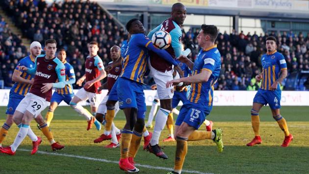 West Ham United's Angelo Ogbonna vie for the ball with Shrewsbury Town’s Aristote Nsiala during their FA Cup match on Sunday. (REUTERS) West Ham United's Angelo Ogbonna vie for the ball with Shrewsbury Town’s Aristote Nsiala during their FA Cup match on Sunday. (REUTERS)