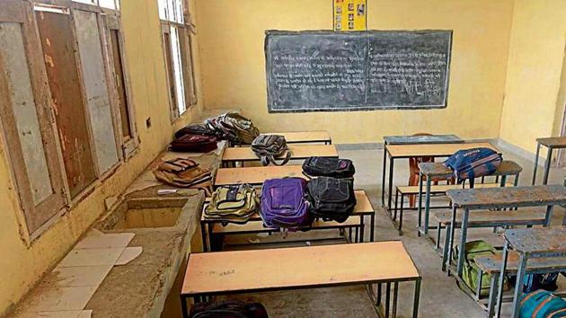 Students at Government Senior Secondary School, Tahli Sahib, 15km from Ludhiana, are making do with plywood planks for windowpanes to save themselves from the biting cold. (Gurpreet Singh/HT) Students at Government Senior Secondary School, Tahli Sahib, 15km from Ludhiana, are making do with plywood planks for windowpanes to save themselves from the biting cold. (Gurpreet Singh/HT)