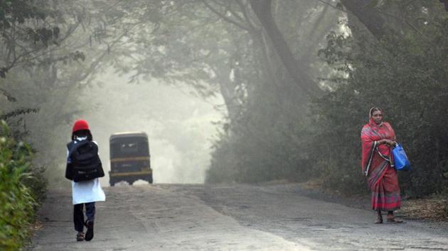 A girl heads to school early Monday morning at Aarey Colony. The last time temperature dropped to 13.6 degrees in January was three years ago. (Satyabrata Tripathy /HT Photo) A girl heads to school early Monday morning at Aarey Colony. The last time temperature dropped to 13.6 degrees in January was three years ago. (Satyabrata Tripathy /HT Photo)