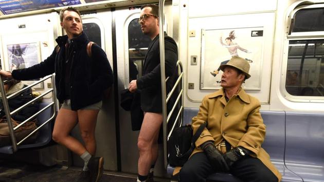 Participants in the 17th No Pants Subway Ride travel in the New York City subway. Riders must also maintain a straight face during their journeys and not acknowledge their fellow passengers’ lack of pants. (Timothy A. Clary / AFP) 