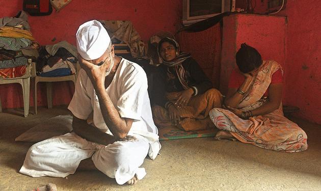 Babaji Phatangale (left) mourns the death of his son Rahul Phatangale, who was killed during the Bhima Koregaon violence. (Pratham Gokhale/HT Photo) Babaji Phatangale (left) mourns the death of his son Rahul Phatangale, who was killed during the Bhima Koregaon violence. (Pratham Gokhale/HT Photo)