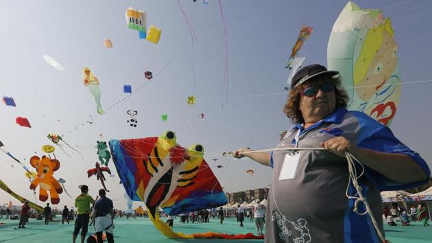 A kite flyer lifts off a stingray shaped kite during the festival in Ahmedabad. Around 150 delegates from 44 countries, including the UK, South Korea, New Zealand, China, Indonesia and Malaysia, have arrived to participate in the event. Nearly 100 enthusiasts from 18 Indian states and hundreds from Ahmedabad also formed part of the crowd. (Ajit Solanki / AP)