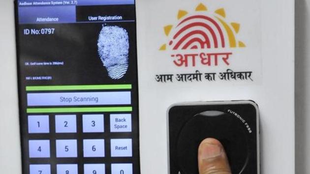 Employees mark their attendance through Aadhaar-based biometric system in the Planning Commission.(HT File Photo)