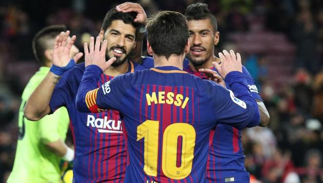 Barcelona's Paulinho celebrates scoring their third goal against Levante with Lionel Messi and Luis Suarez at Camp Nou on Sunday. (Reuters) Barcelona's Paulinho celebrates scoring their third goal against Levante with Lionel Messi and Luis Suarez at Camp Nou on Sunday. (Reuters)