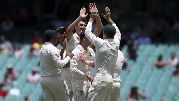 Australia's Pat Cummins, center, celebrates with teammates after dismissing England's Stuart Broad during the last day of their Ashes Test in Sydney on Monday. Australia won the Test by an innings and 123 runs to complete a 4-0 series win. (AP) Australia's Pat Cummins, center, celebrates with teammates after dismissing England's Stuart Broad during the last day of their Ashes Test in Sydney on Monday. Australia won the Test by an innings and 123 runs to complete a 4-0 series win. (AP)