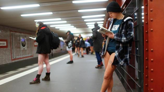People take part in the 2018 No Pants Subway Ride in Berlin, Germany. Every year since, random passengers board subway cars in the middle of winter, dressed in their usual winter coats, hats, scarves and gloves... the only notable absence --their trousers. (Hannibal Hanschke / REUTERS) 