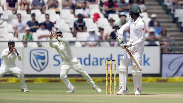 Virat Kohli catches the ball for the second wicket of the morning on the fourth day of the first test between South Africa and India at Newlands Stadium, in Cape Town, South Africa. (Halden Krog / AP)