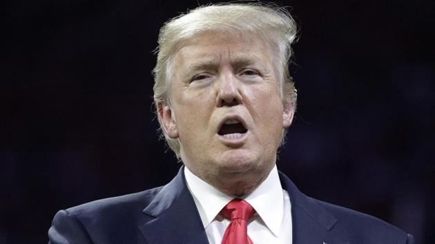 President Donald Trump sings the national anthem before a college football playoff championship, in Atlanta Monday. (AP Photo) President Donald Trump sings the national anthem before a college football playoff championship, in Atlanta Monday. (AP Photo)